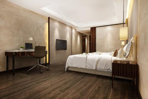 3d-rendering-beautiful-luxury-bedroom-suite-in-hotel-with-tv-and-working-table-min