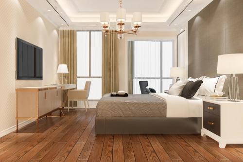 3d-rendering-beautiful-luxury-bedroom-suite-in-hotel-with-tv-min